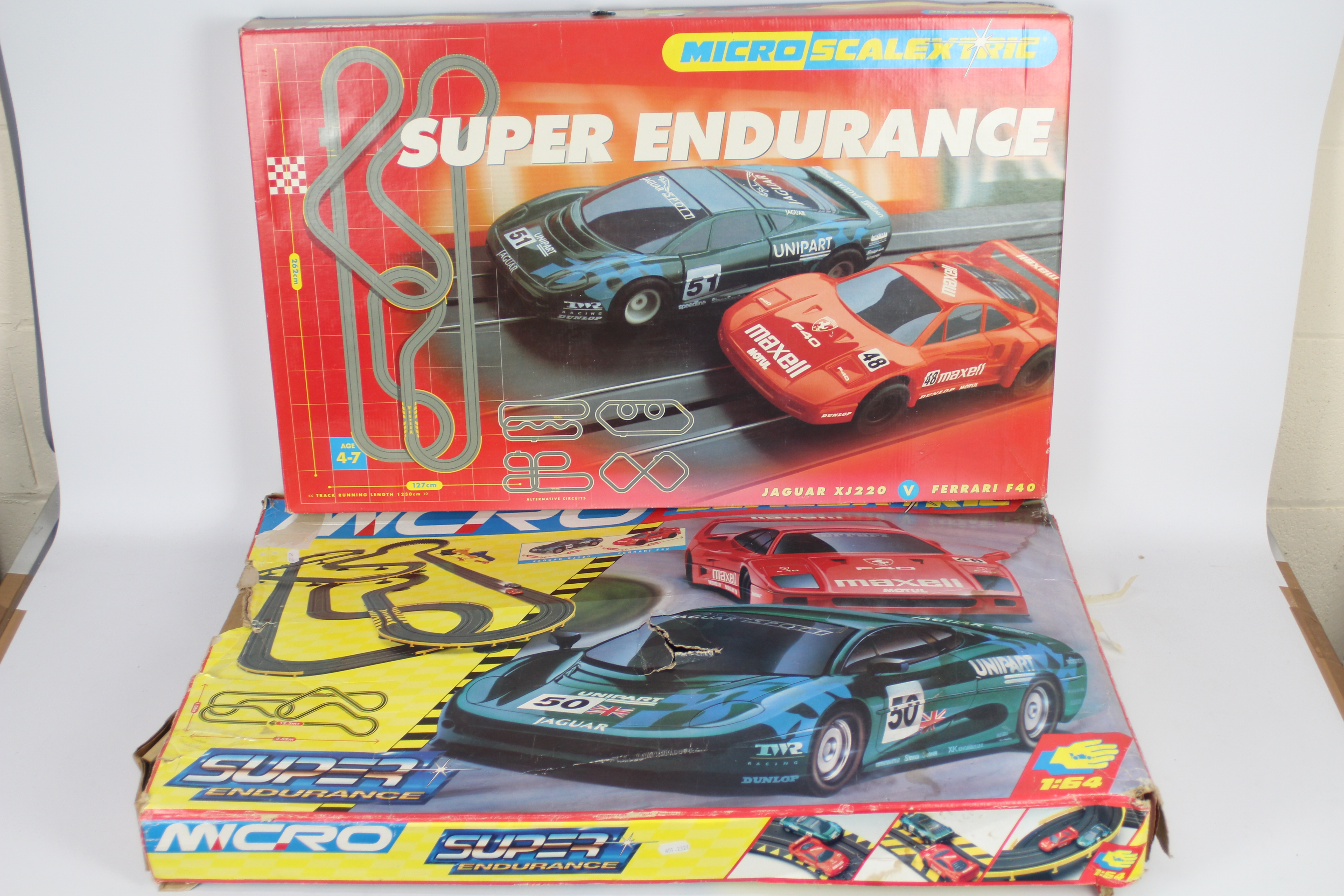 Scalextric - 2 x boxed # G090 Micro Scalextric Super Endurance sets in 1:64 scale.