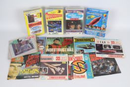 A collection of 7 x vinyl Thunderbirds records and 3 x Thunderbirds video cassette tapes - Lot