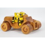 Frank Egerton - A rare hand crafted wooden sports car with two tiger figures made by the late