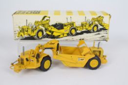 NZG - A boxed CAT 627 Push-Pull Scurfzug scraper in 1:50 scale. # 127.