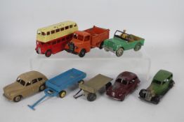 Dinky Toys - An unboxed collection of eight Dinky Toys.