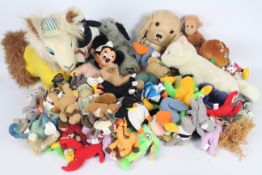 A collection of soft toys to include Ty Beanies, Sooty & Sweep hand puppets,