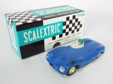 Scalextric - a boxed vintage Jaguar D Type in blue,