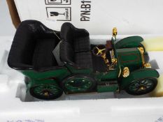 Franklin Mint - A boxed 1:24 scale 1905 Rolls Royce 10HP by Franklin Mint .