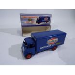 Dinky - A boxed Guy Van in Ever Ready livery # 918.