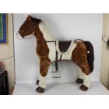 Costco - An unboxed Costco Sit-On Plush toy horse.