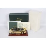 Gwilo - A boxed 1:18 scale 22ct Gold plated 1:18th scale diecast Jaguar XJ220 by Gwilo.