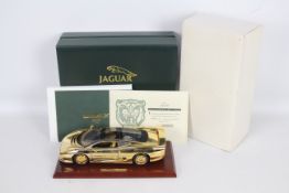 Gwilo - A boxed 1:18 scale 22ct Gold plated 1:18th scale diecast Jaguar XJ220 by Gwilo.