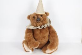 Circus Bear - A large Brown Bear with a circus hat and collar.