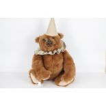 Circus Bear - A large Brown Bear with a circus hat and collar.