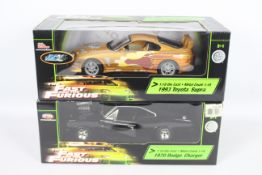 Racing Champions / Ertl, Joyride - Two boxed 1:18 scale 'Fast & Furious' diecast model cars.