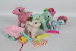 My Little Pony, Hasbro - A collection of four loose My Little Pony G1 Ponies and Baby Ponies.