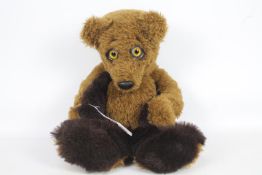 Unnamed - A fully jointed long limb bear with large glass eyes and soft two tone brown fur.