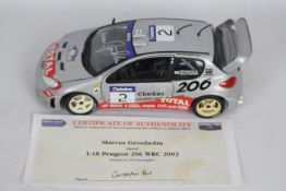 Solido - A signed limited edition 1:18 scale Peugeot 20 WRC 2002 signed on the windscreen by Marcus