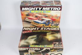 Scalextric - 2 x vintage boxed sets, # C.880 Mighty Metros and # C.740 Night Stages Escort XR3i set.