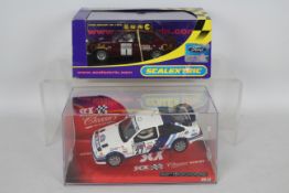 SCX - Scalextric - 2 x boxed 1:32 scale slot cars,