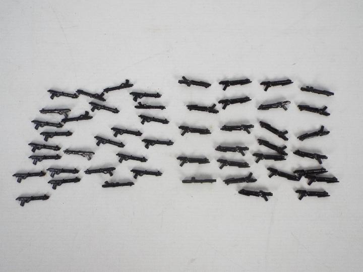Approximately 48 plastic weapons suitable for 3.75 action figures.