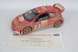 Solido - A signed limited edition 1:18 scale dirty finish Peugeot 206 WRC 2003 signed on the