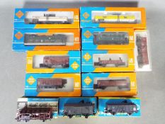 Roco, Piko, Liliput - 12 boxed items of HO gauge passenger and freight rolling stock.