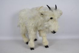 Ozark Studio - A standing Goat soft toy with a label stating Ozark Studio Original by DAL.