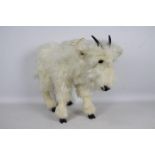 Ozark Studio - A standing Goat soft toy with a label stating Ozark Studio Original by DAL.