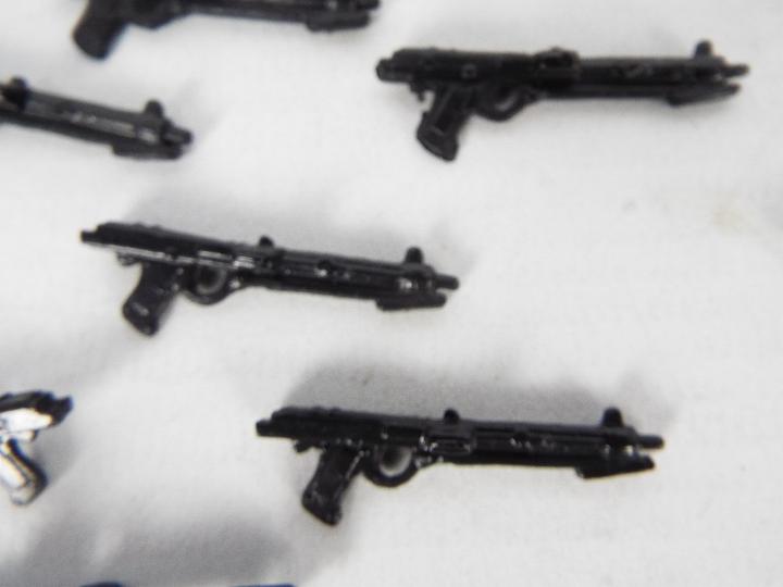 Approximately 48 plastic weapons suitable for 3.75 action figures. - Image 2 of 2