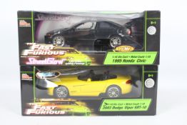 Racing Champions / Ertl - Two boxed 1:18 scale 'Fast & Furious' diecast model cars.