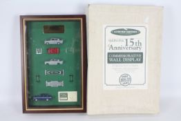 Lledo - A limited edition framed Ford Anglia commemorative wall display with two complete models