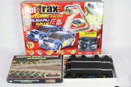 Scalextric - Hot Trax - A boxed radio controlled Subaru Fast Rally set and a Scalextric Hazard