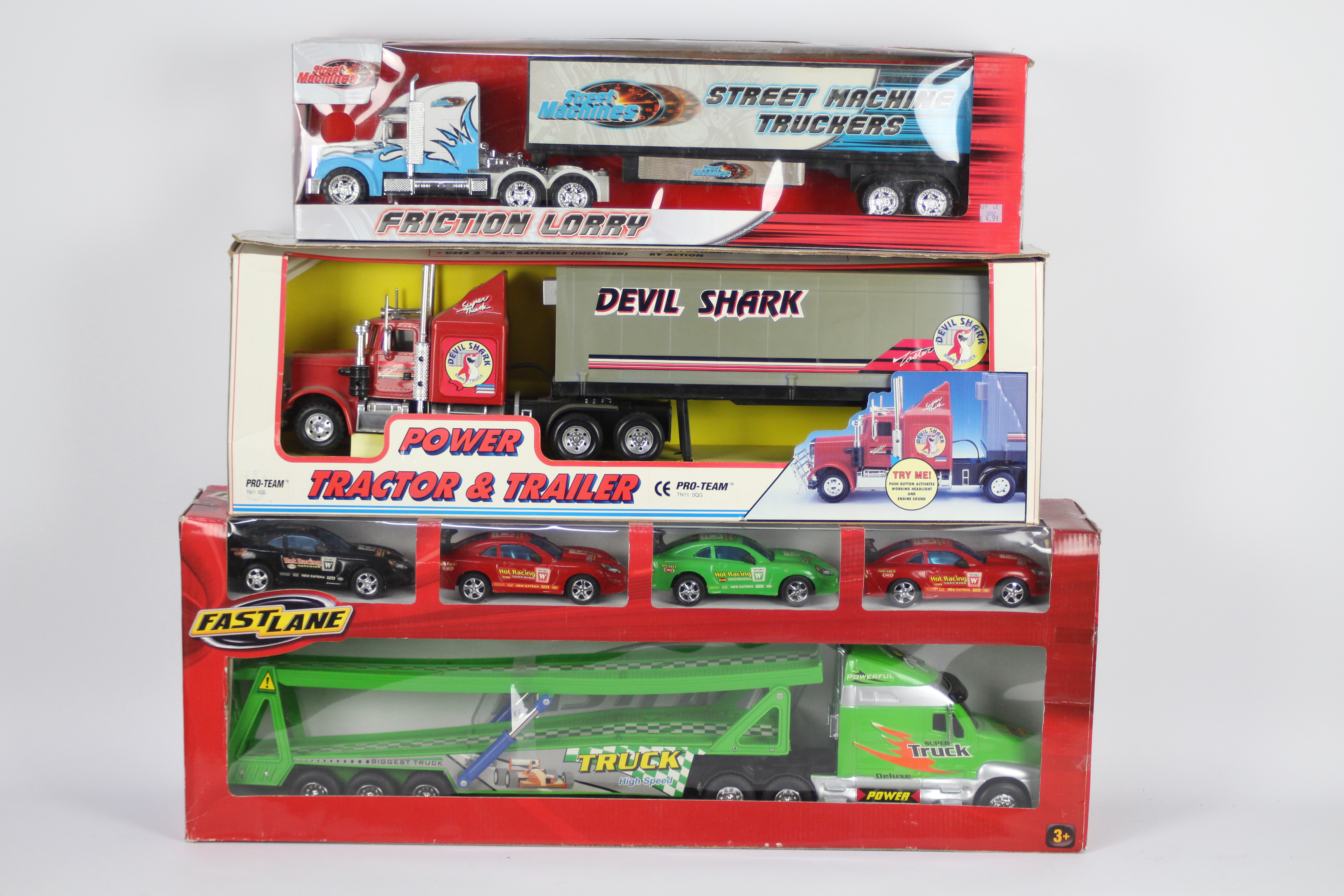 Fast Lane - Pro Team - 3 x boxed American style trucks including the Devil Shark Super Truck,