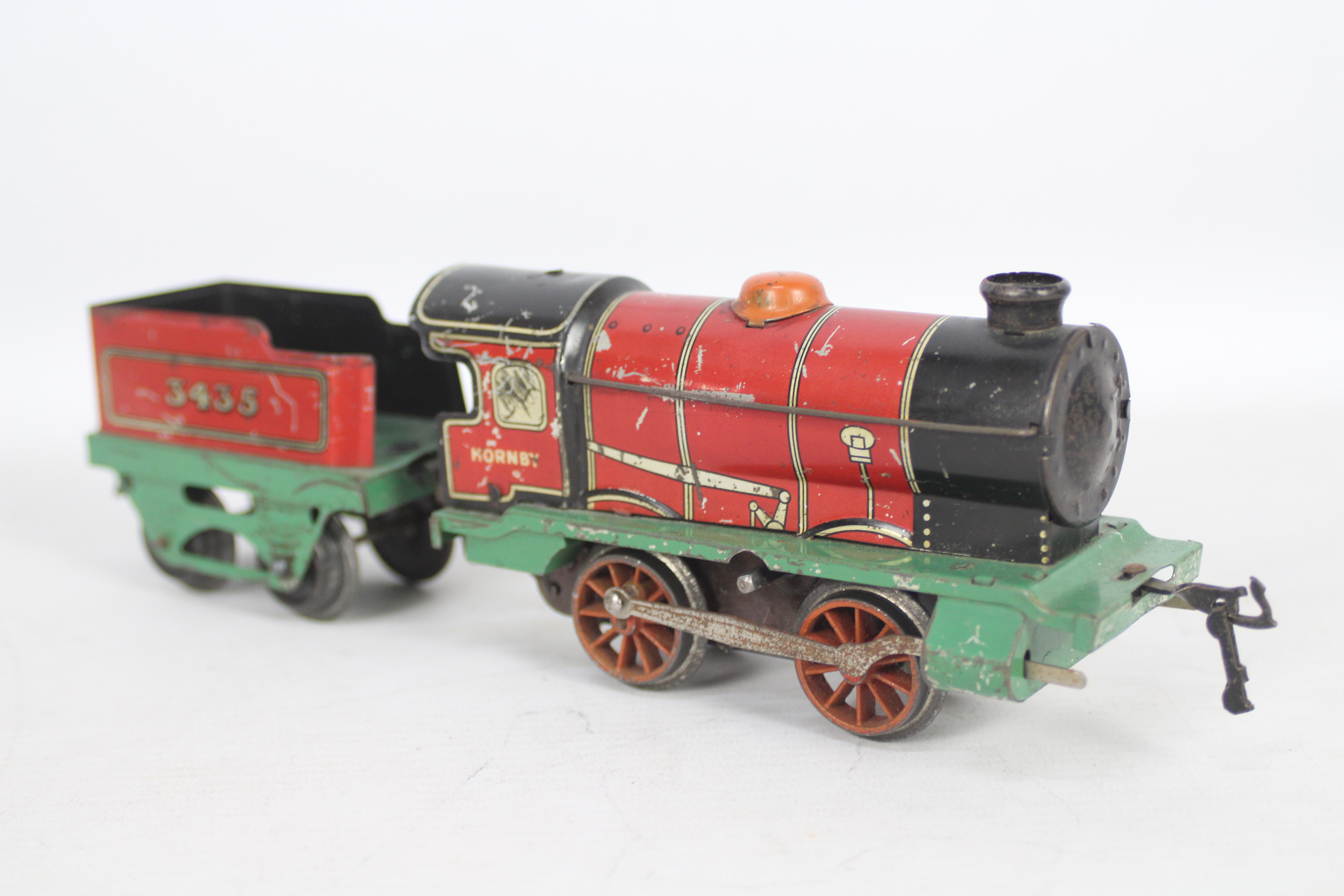 Hornby - A 1930s clockwork 0-4-0 tender loco number 3435 in red and green livery. - Image 2 of 3