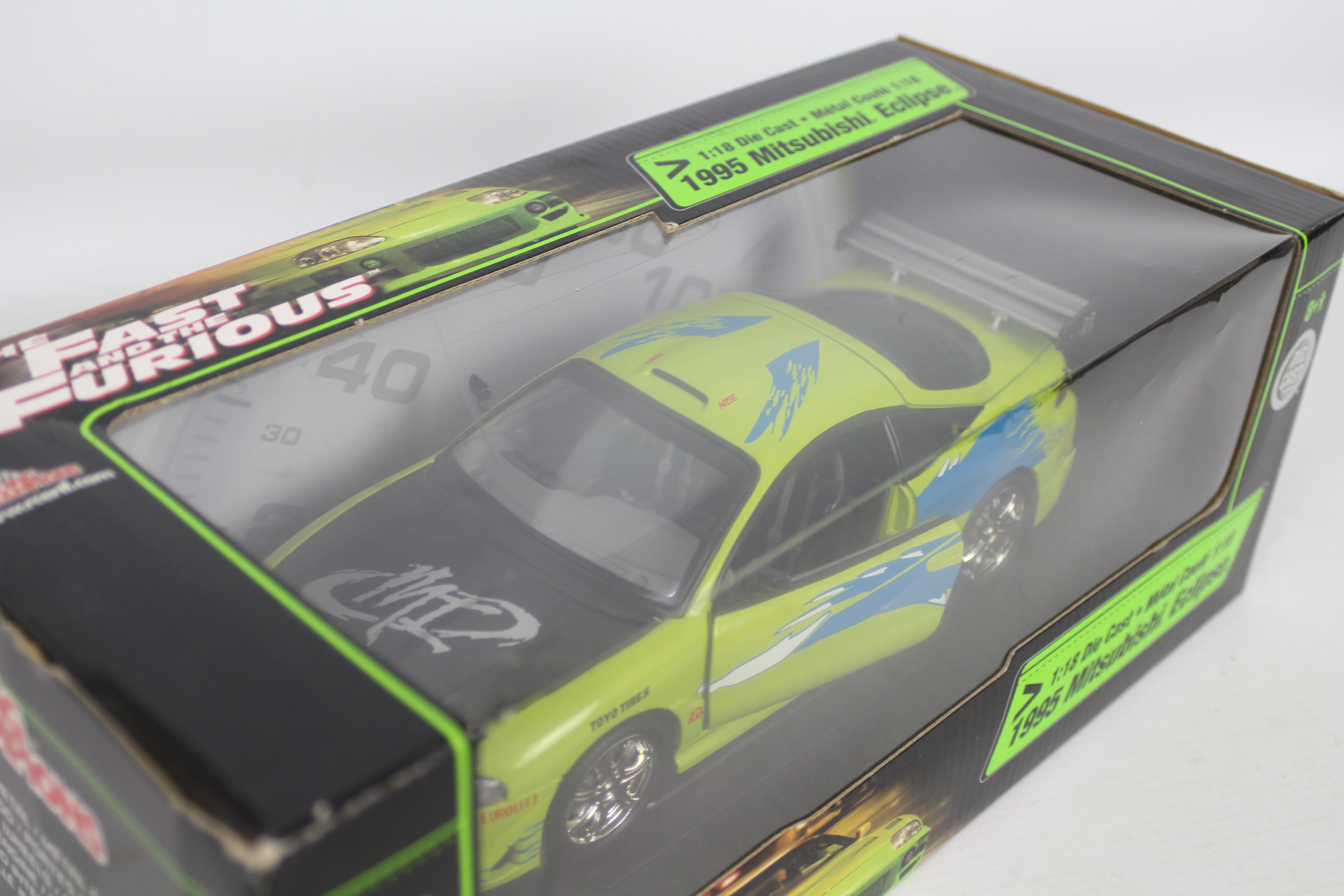 Racing Champions / Ertl - A boxed 1:18 scale 'Fast & Furious' diecast 1995 Mitsubishi Eclipse. - Image 3 of 3