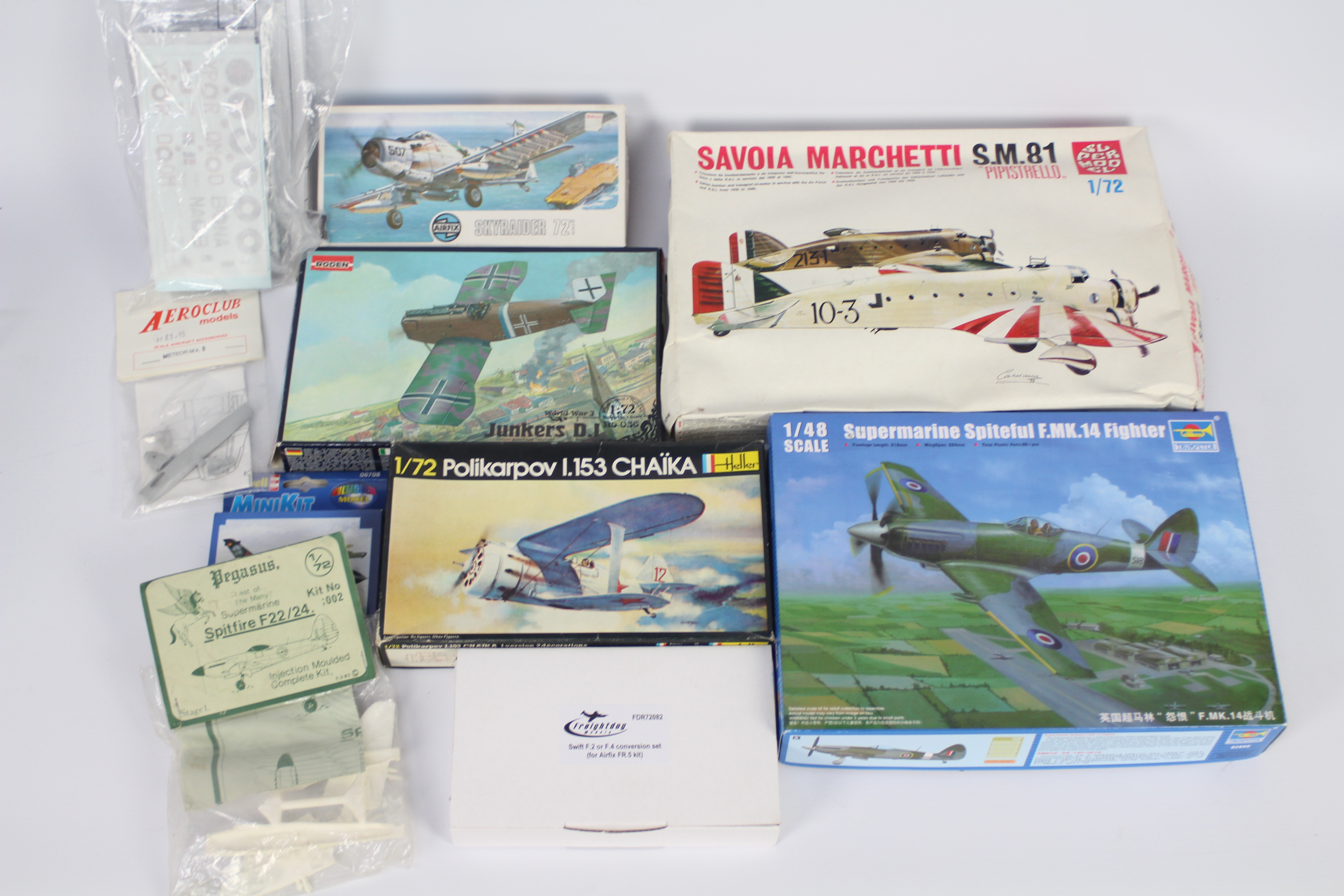 A collection of 10 predominately boxed / bagged plastic model kits and model conversion kits in