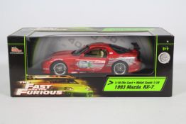 Racing Champions / Ertl - A boxed 1:18 scale 'Fast & Furious' diecast 1993 Mazda RX-7.