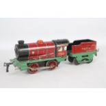 Hornby - A 1930s clockwork 0-4-0 tender loco number 3435 in red and green livery.