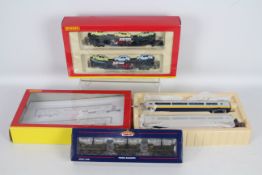 Hornby, Bachmann - Three boxed items of OO gauge passenger and freight rolling stock.