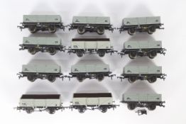 Bachmann, Airfix, Dapol - A rake of 12 unboxed OO gauge plank wagons.