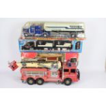 New Bright - 4 x large American trucks including a remote control truck with a battery powered