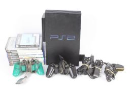 Sony - Playstation - A Sony PS2 console with two controllers,
