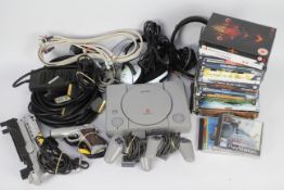 Sony - Playstation - A Sony Playstation console with two controllers, cables, two gun controllers,