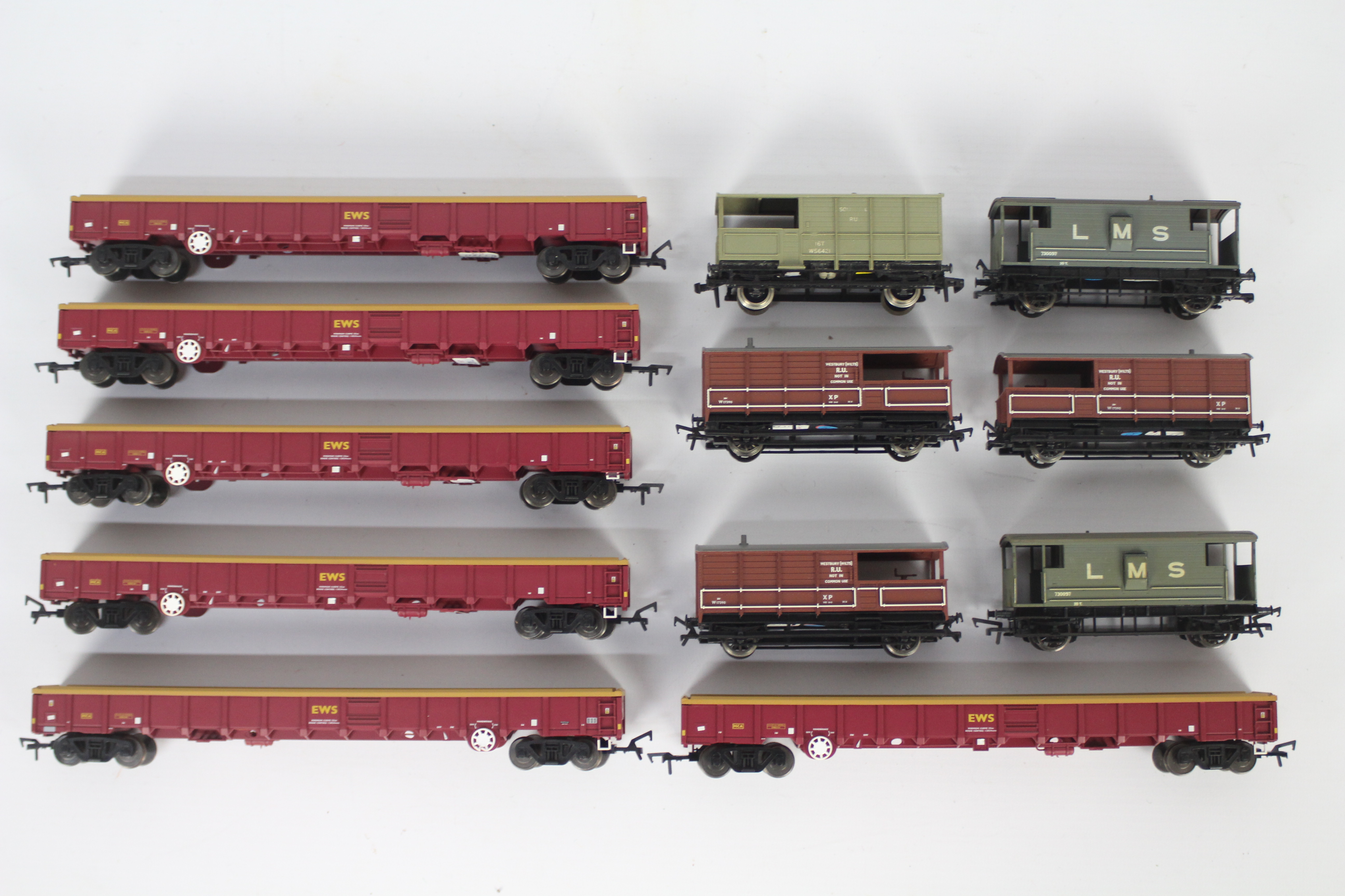 Bachmann, Dapol, Hornby Dublo, Airfix - 12 unboxed OO gauge freight rolling stock wagons / vans.