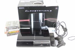 Sony - Playstation - A boxed Sony Playstation 3 and games.