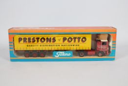 Tekno - A boxed Tekno #35 'The British Collection' 1:50 scale diecast Volvo F10 Curtainside