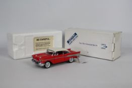 Franklin Mint - A boxed 1:24 scale 1957 Chevrolet Bel Air by Franklin Mint.