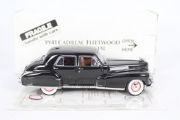 Danbury Mint - A boxed 1:24 scale 1941 Cadillac Fleetwood Series 60 Special by Danbury Mint.
