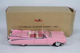 Maisto - A boxed Maisto 1:12 scale Cadillac Biarritz.