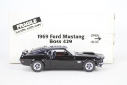 Danbury Mint - A boxed 1:24 scale diecast 1969 Ford Mustang Boss 429 by Danbury Mint.