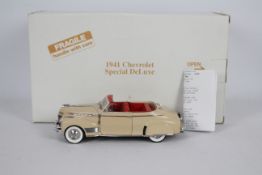 Danbury Mint - A boxed 1:24 scale 1941 Chevrolet Special Deluxe by Danbury Mint.