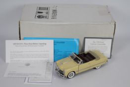 Franklin Mint - A boxed 1:24 scale 1949 Ford Custom Convertible by Franklin Mint.