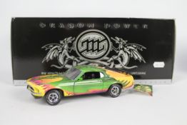 Franklin Mint - A boxed Ford Mustang Boss 302 finished in a special Michael Whelan Dragon Power